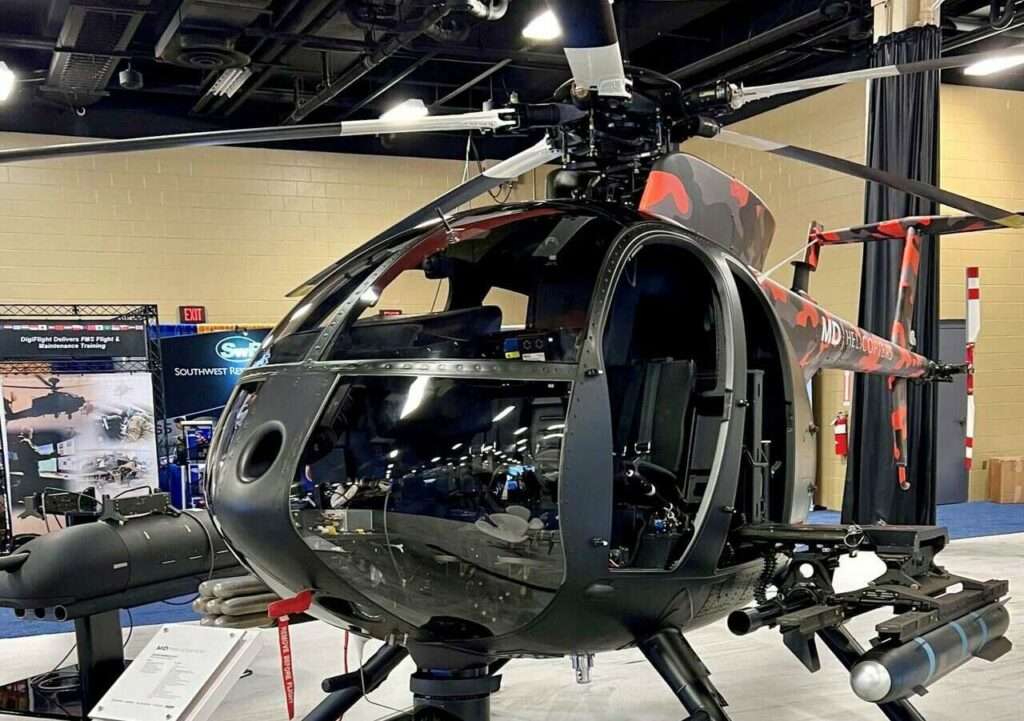 An MD Helicopters Cayuse Warrior helicopter in the hangar.