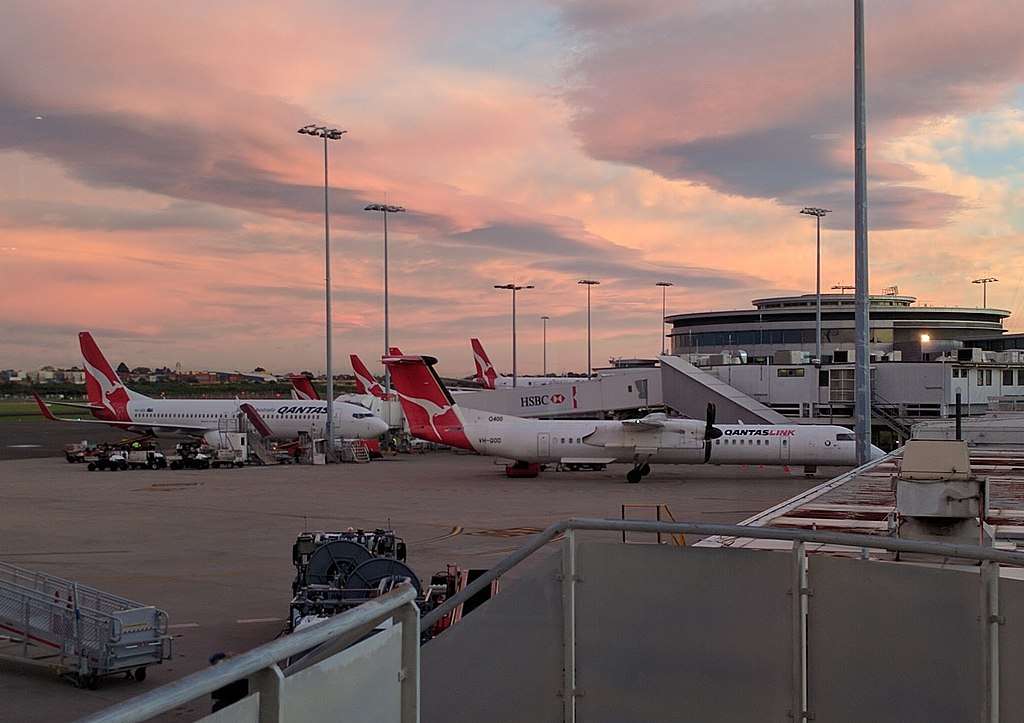 Sydney Airport domestic terminal airside at dusk.