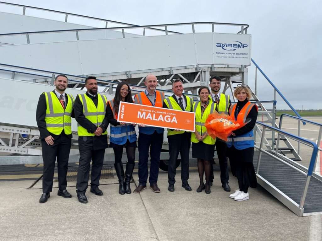 London Southend Airport staff with easyJet Malaga banner