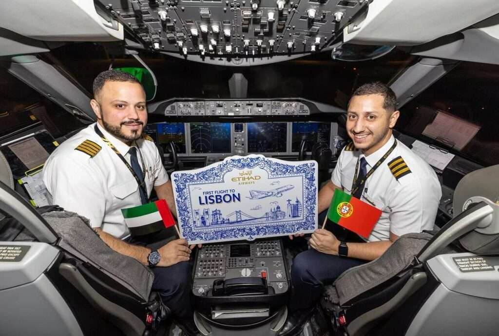Pilots on the flightdeck of an Etihad Airways 787 celebrate the new Lisbon flight.