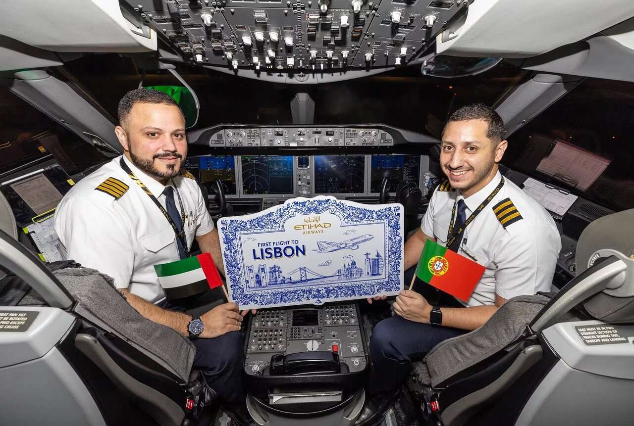 Pilots on the flightdeck of an Etihad Airways 787 celebrate the new Lisbon flight.