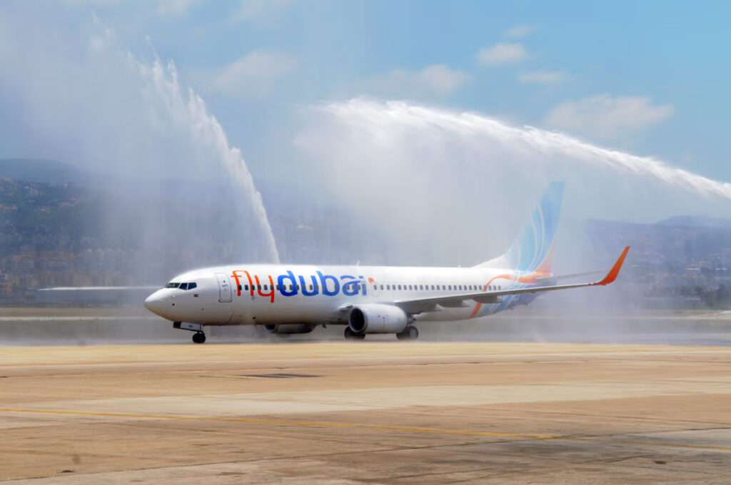 a flydubai aircraft receives a water cannon salute.