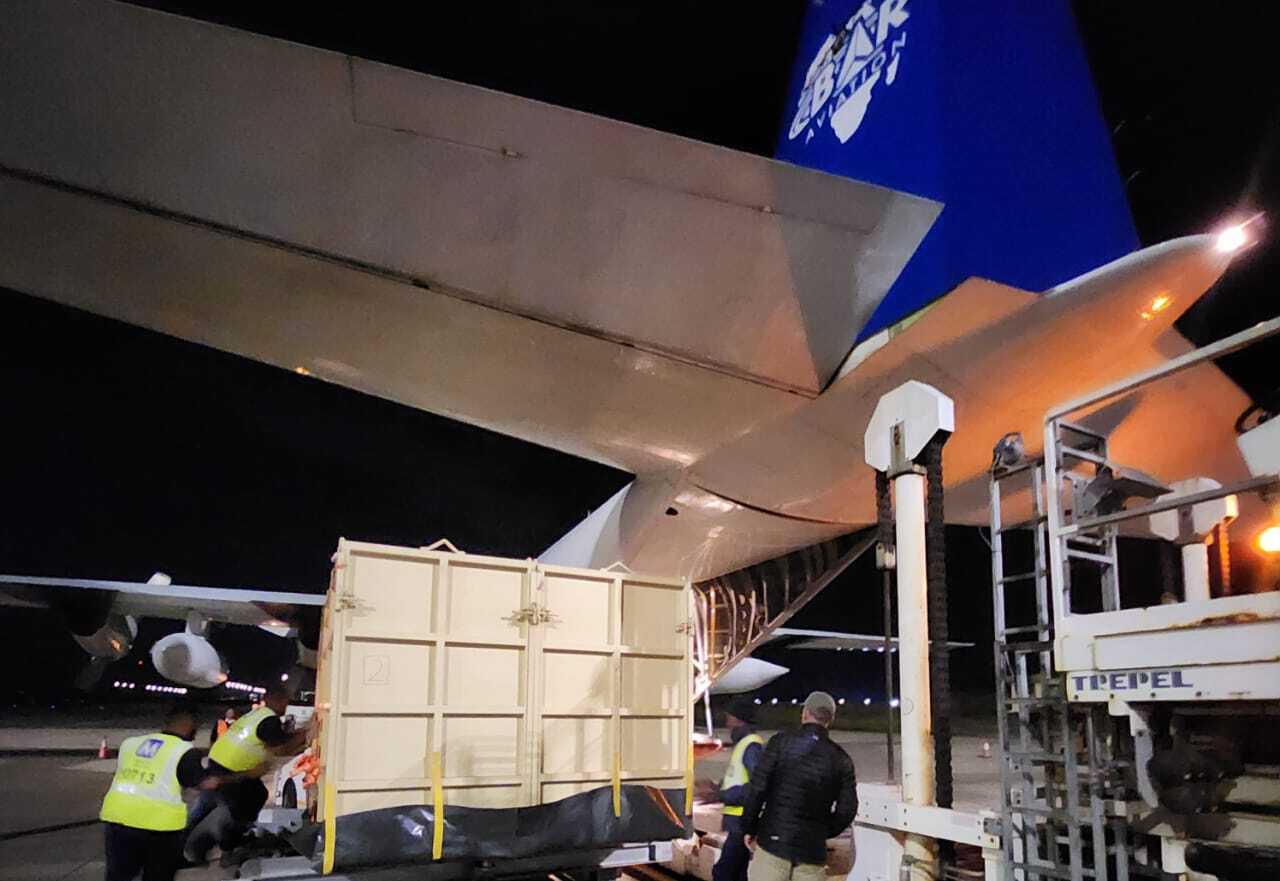 A rhino is loaded onto a BAR Aviation C-130 Hercules transport