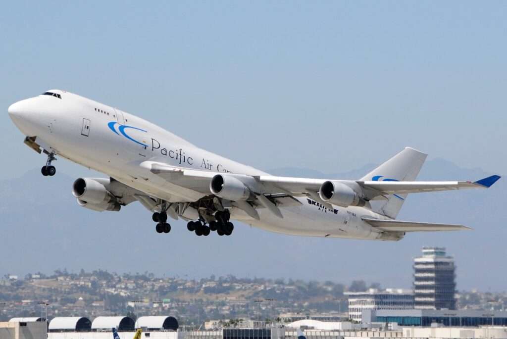 A Pacific Air Cargo 747 freighter becomes airborne.