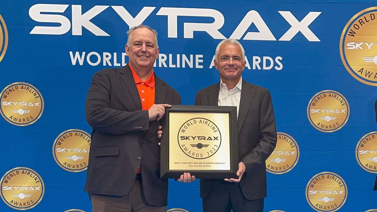 CEO of Sun Country accepts a Skytrax Award.