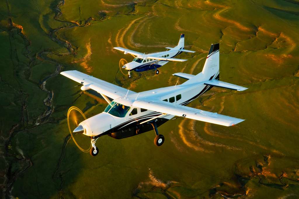 Two Cessna caravan aircraft in flight