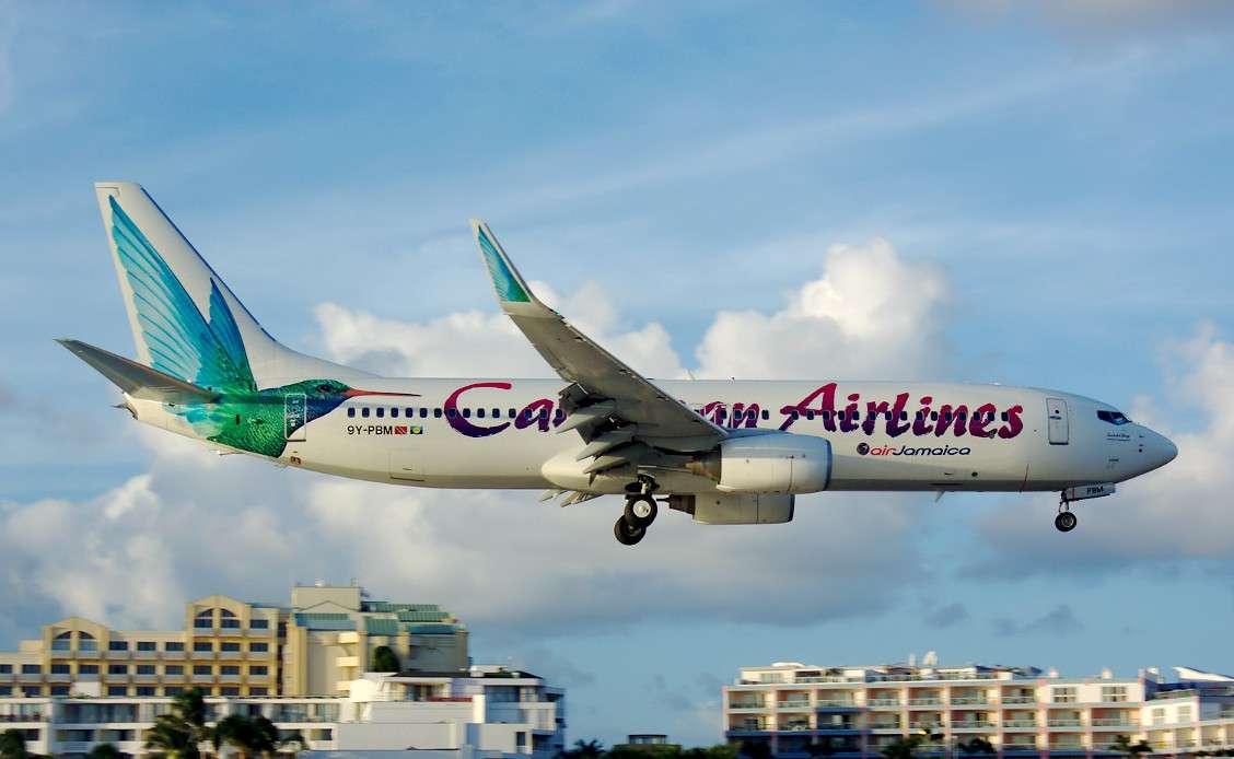 A Caribbean Airlines Bowing 737 on approach to land.