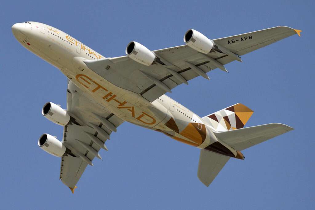 An Etihad Airways Airbus A380 passes overhead.