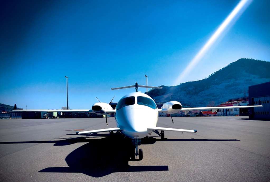 Front view of a Piaggio Aerospace aircraft on the tarmac.