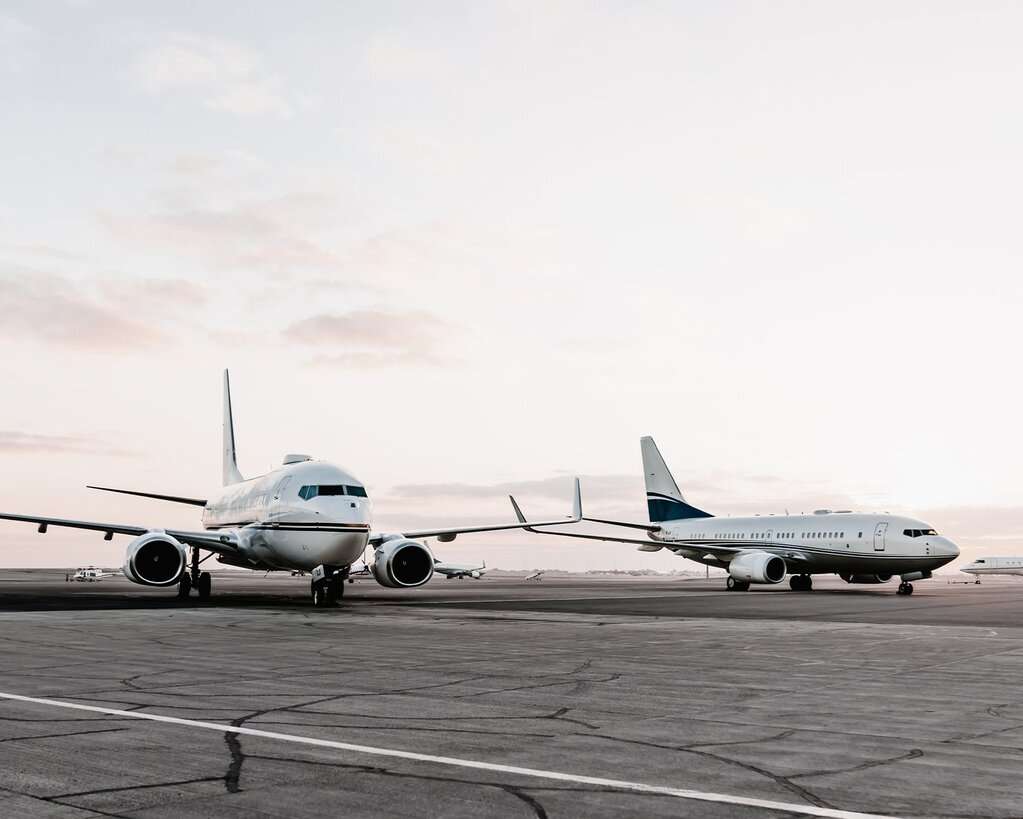 Two RoyalJet aircraft parked on the tarmac.
