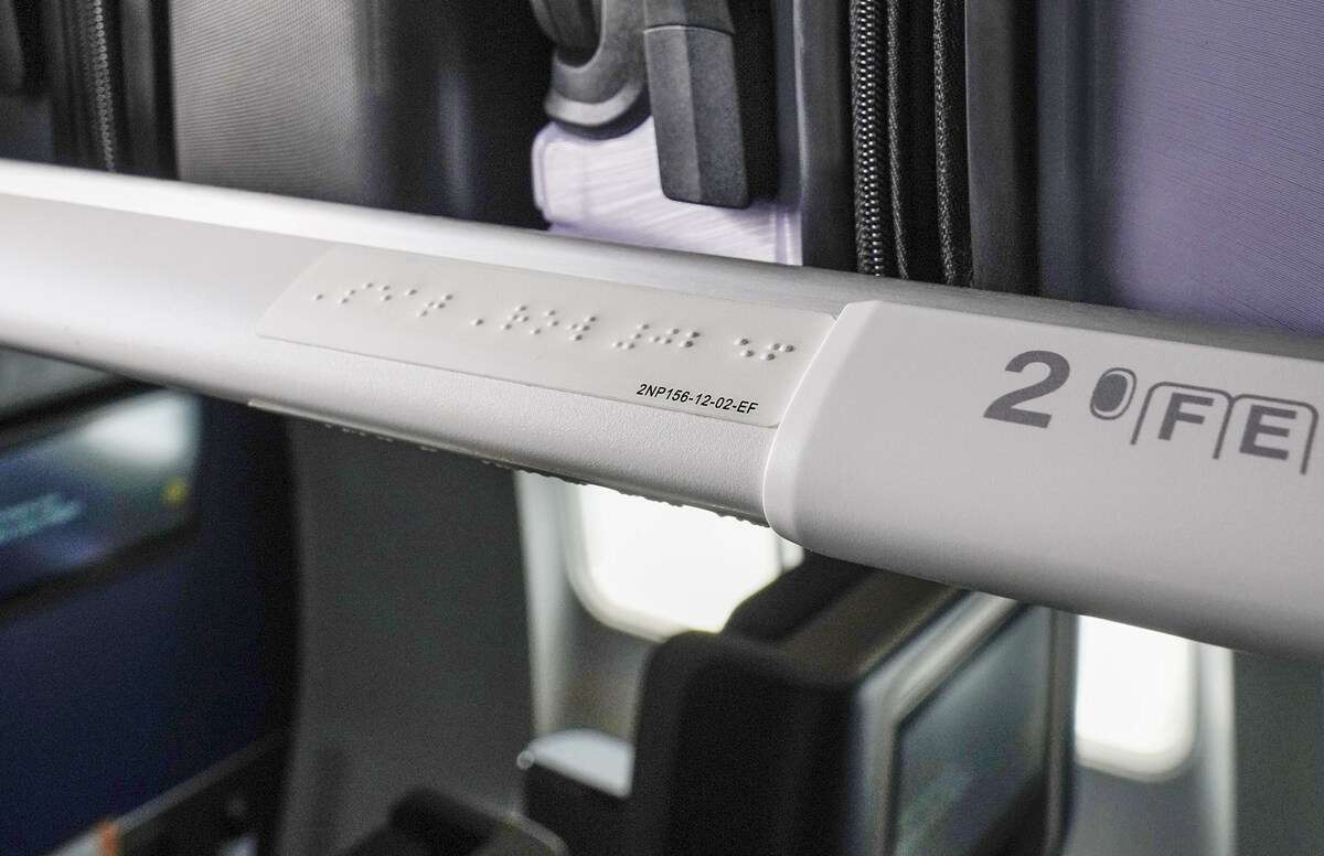 Image of Braille markings for an individual row on a United Airlines aircraft.