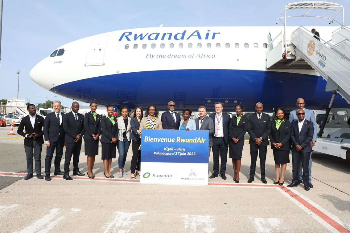 RwandAir aircraft and staff members at Paris airport.