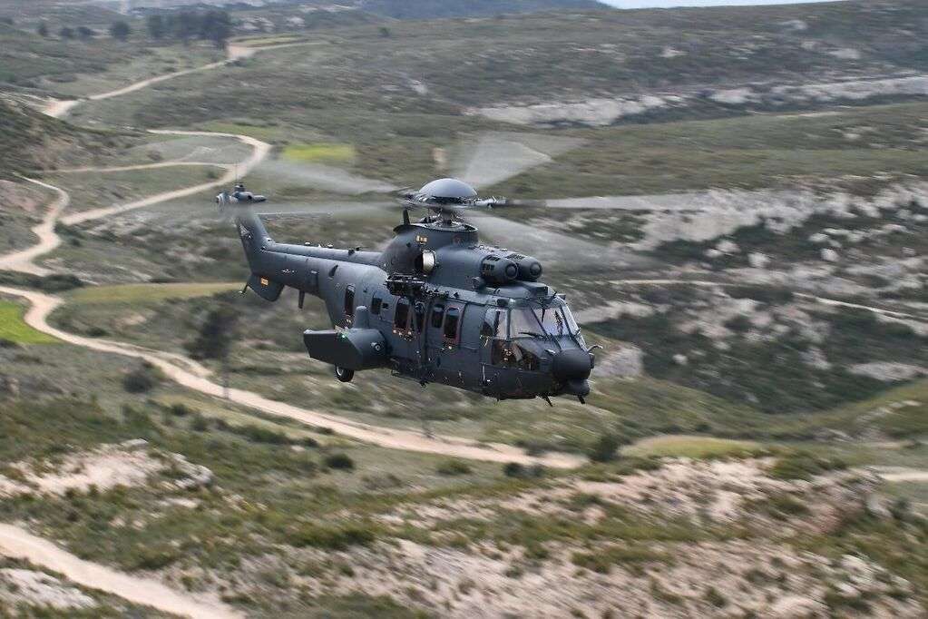 An Airbus H225M helicopter in flight.