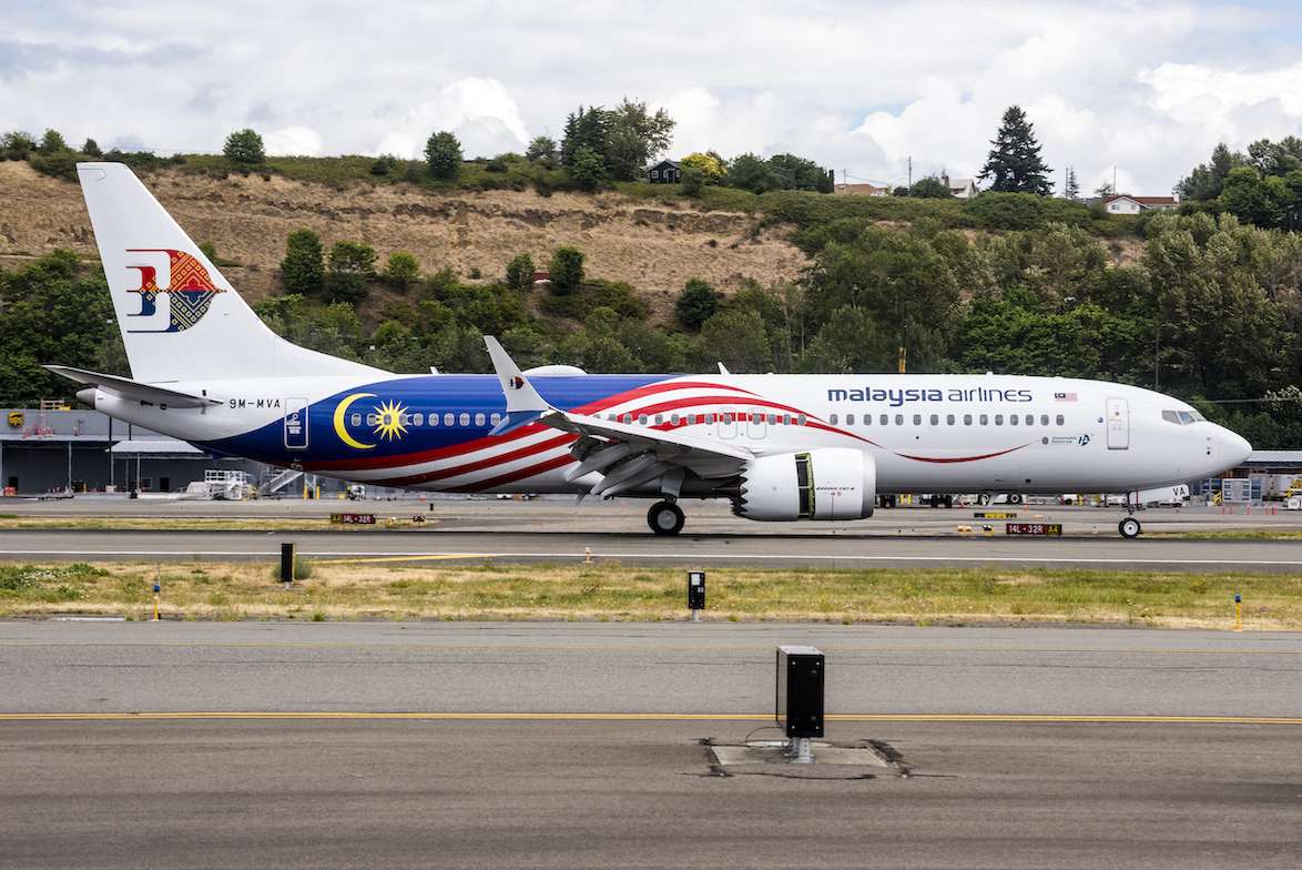 A Malaysia Airlines Boeing 737-8 on the taxiway.