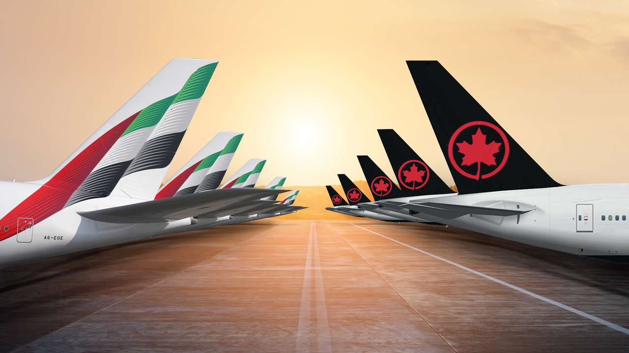 Render of tailplanes of Emirates and Air Canada aircraft.