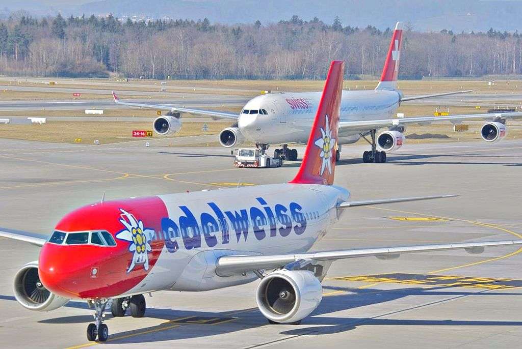 An Edelweiss Airbus A320 parked on the tarmac.