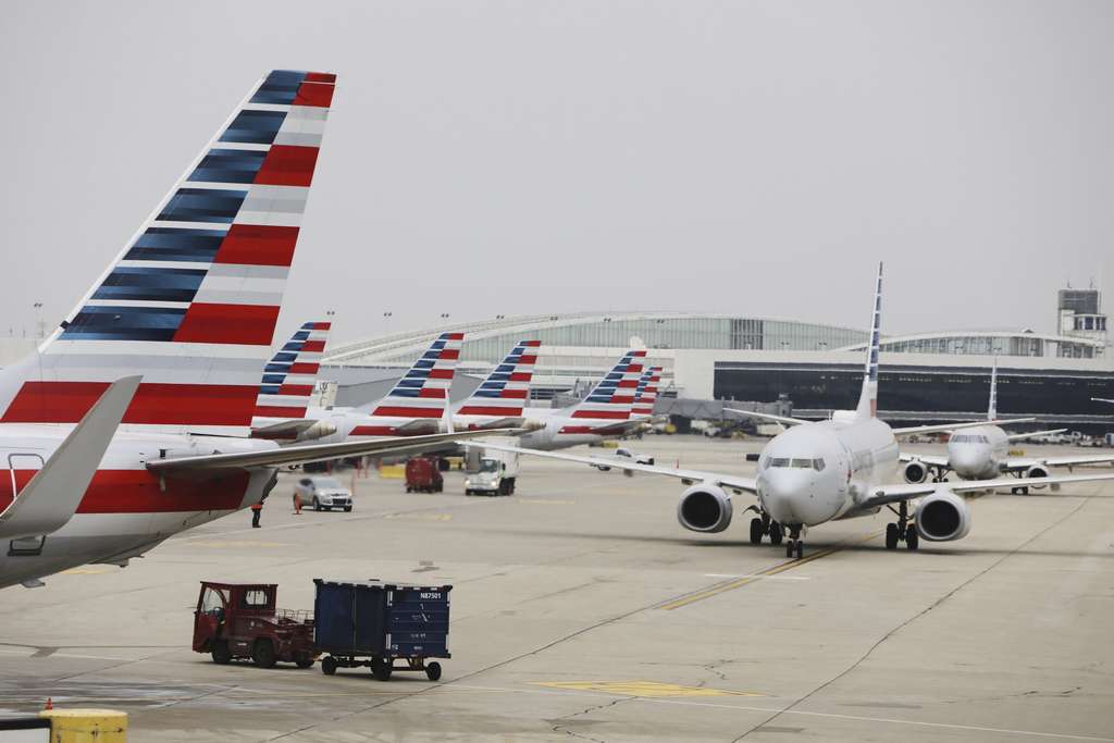 A lineup of parked American Airlines aircraft.