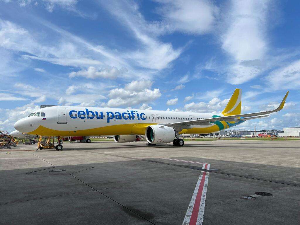 A Cebu Pacific Airbus A321neo parked on the tarmac.