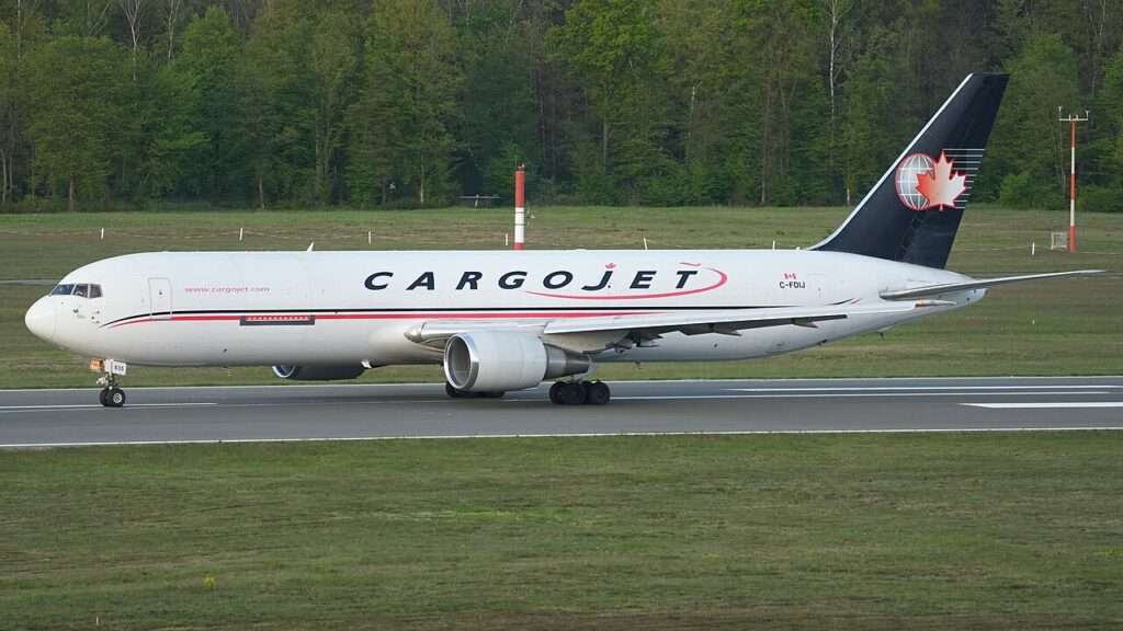 A Cargojet converted freighter lines up on the runway.