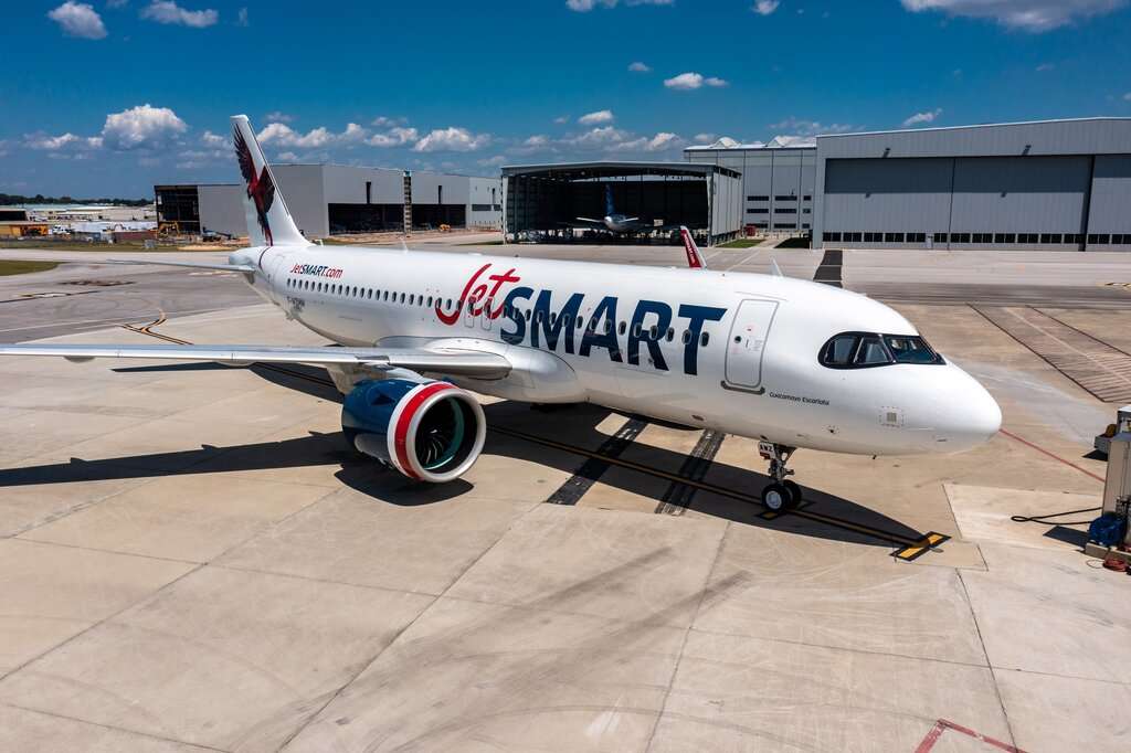 A JetSMART Airbus A320neo parked on the tarmac.