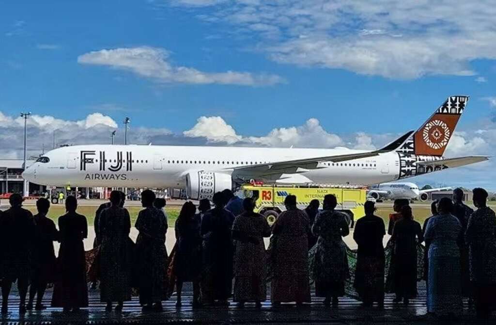 A crowd watches Fiji Airways A350-900XWB taxi in.