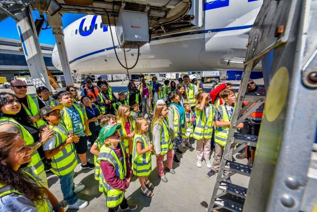 Students receive a tour of a United Airlines aircraft.
