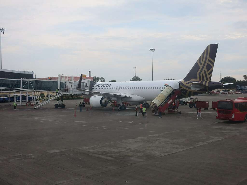 A Vistara Airbus A320 parked on the tarmac.
