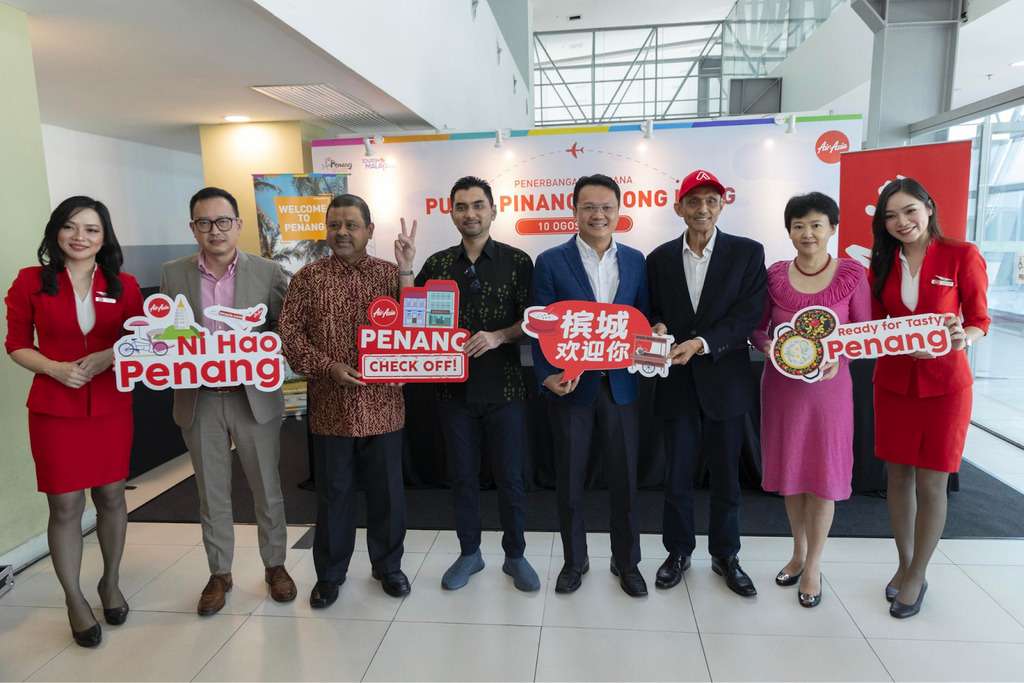AirAsia staff celebrate new Penang-Hong Kong service.
