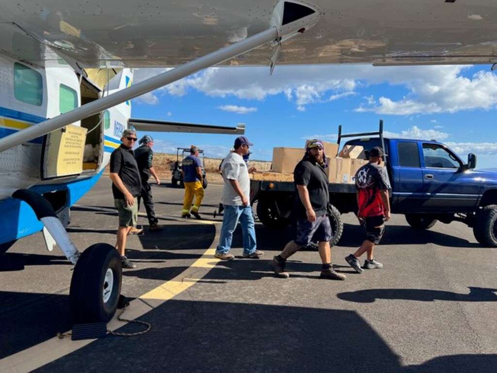 Kamaka Air staff uplift supplies during Maui wildfires.