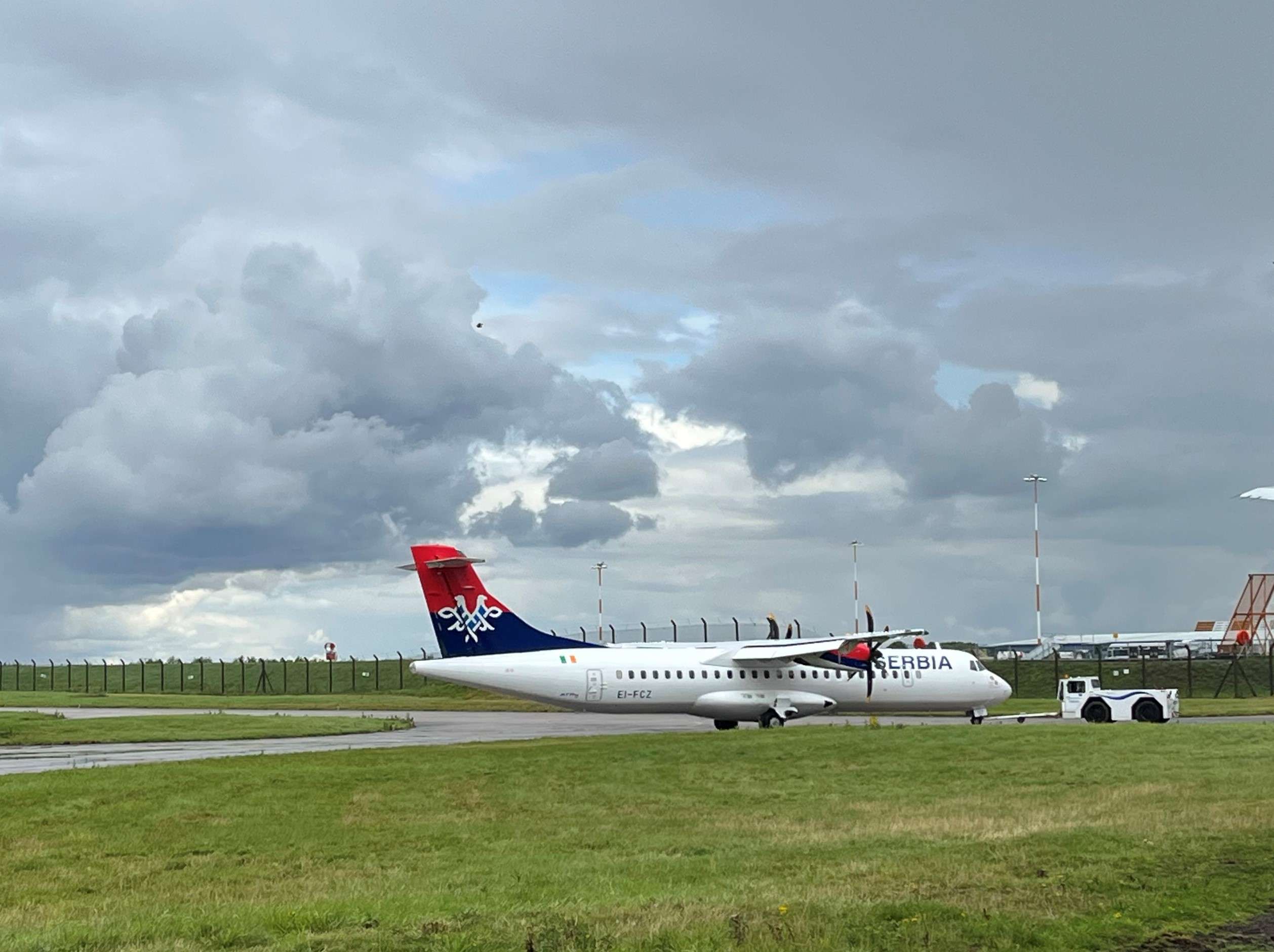 An Air Serbia ATR 72 aircraft parked on the tarmac.