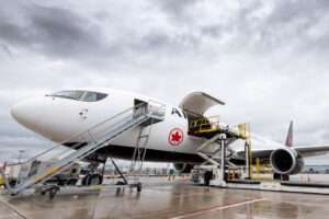 An Air Canada Cargo freighter aircraft is loaded.