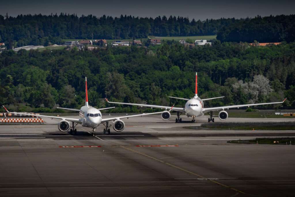 Two SWISS Airlines aircraft on the taxiway.