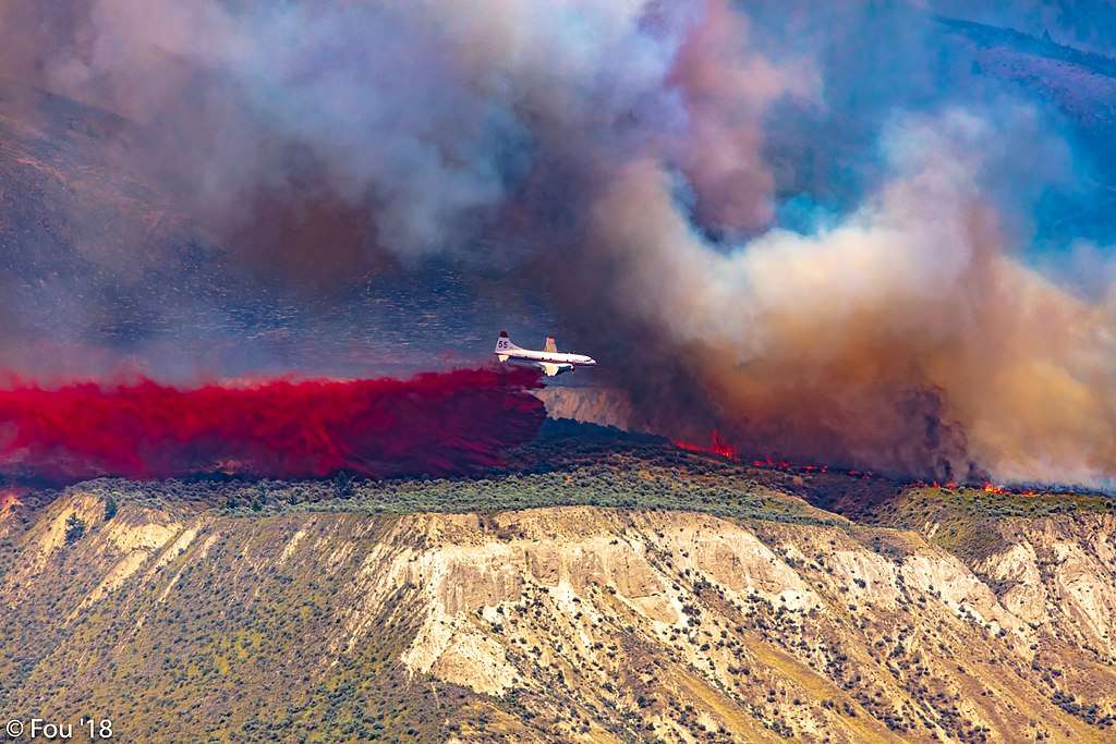 An air tanker drops retardant on a wildfire in British Columbia, Canada.