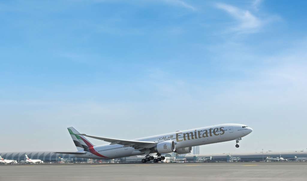 An Emirates Boeing 777-300ER takes off.