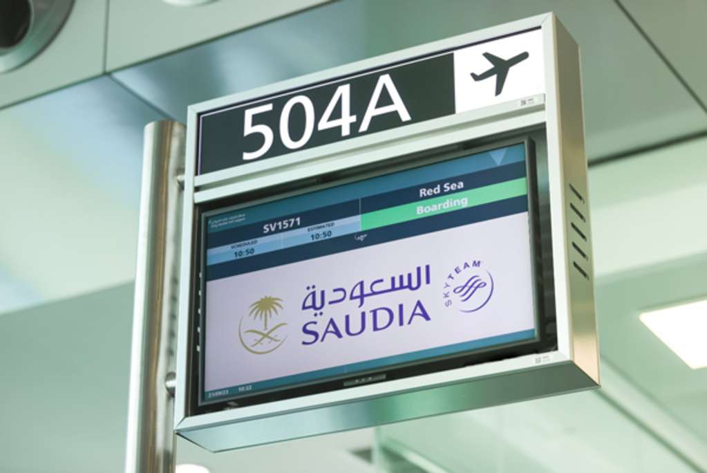 Airport signage for SAUDIA flight to Red Sea International Airport