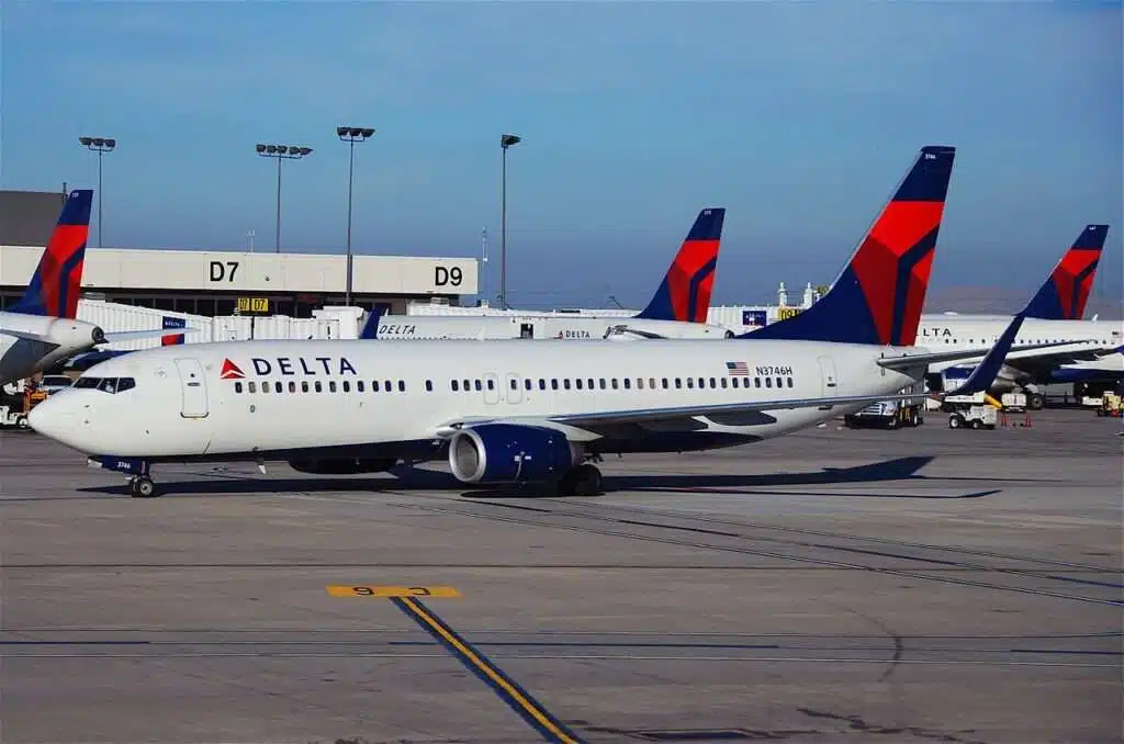 Delta Air Lines aircraft parked together on the tarmac.