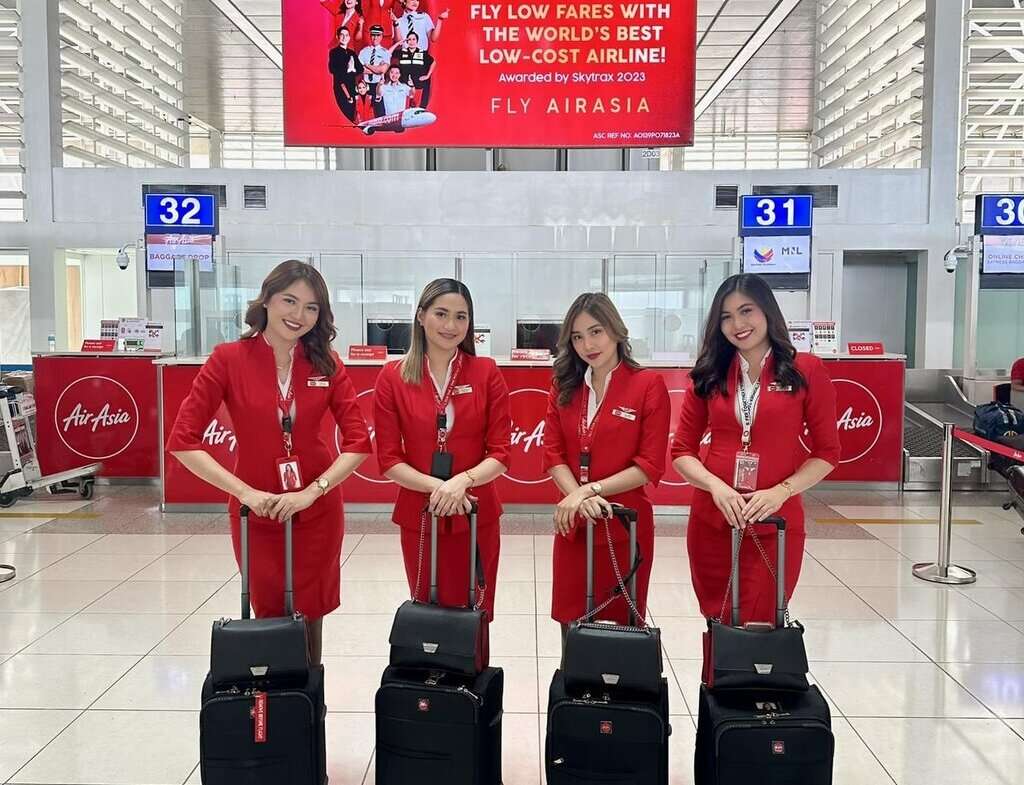 AirAsia Philippines cabin crew in airport terminal.
