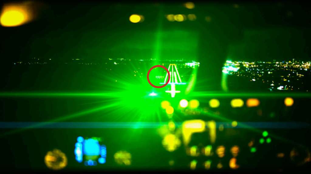 Effect of a laser pointed at an aircraft landing at night.