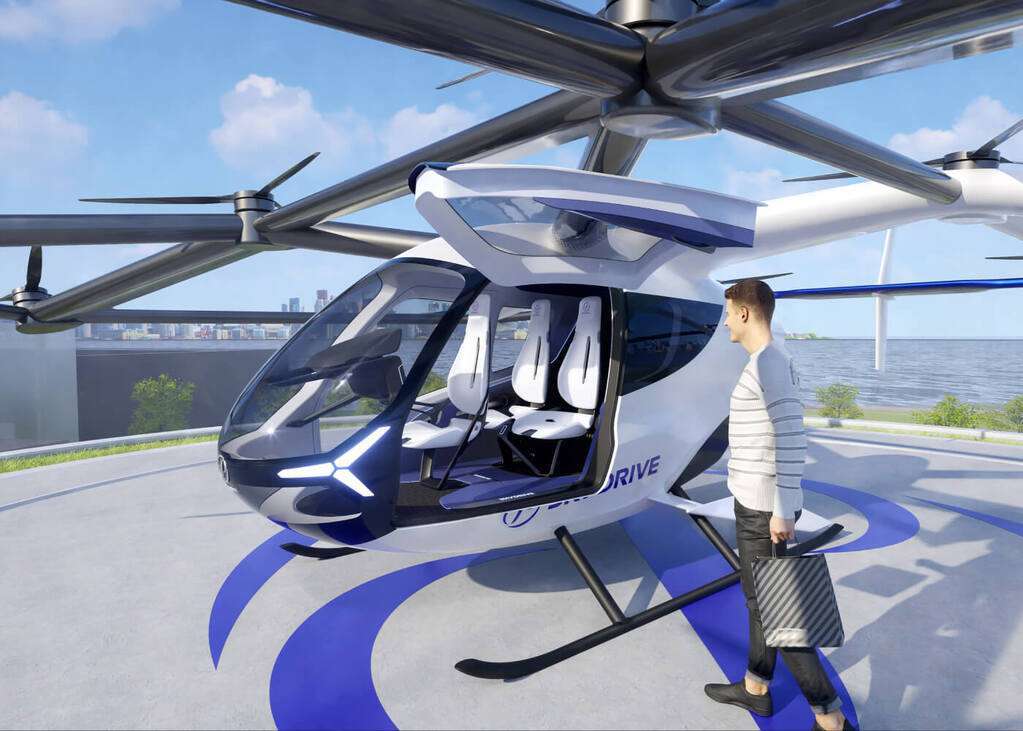 Render of a Skydrive eVTOL aircraft on a helipad.