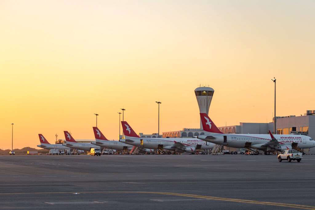 View of flightline at Sharjah International Airport in the evening.