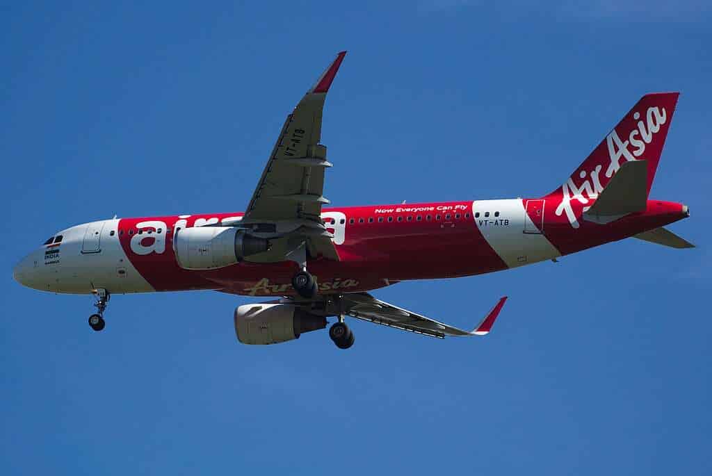 An AirAsia India A320neo passes overhead.