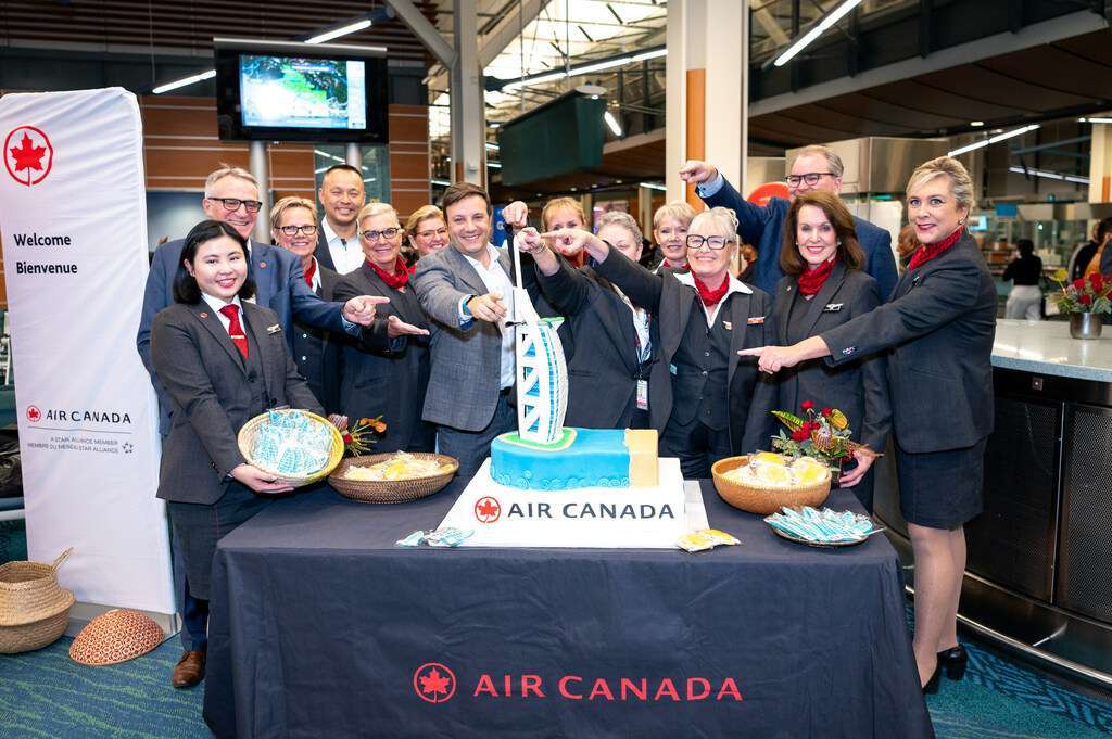 Air Canada staff celebrate inaugural Vancouver to Dubai flight.