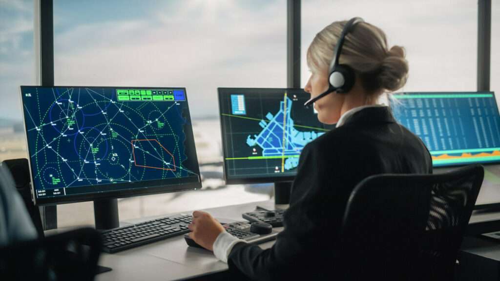 An air traffic controller at a computer screen.