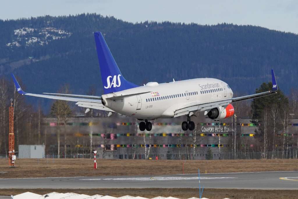 An SAS Boeing 737 takes off.