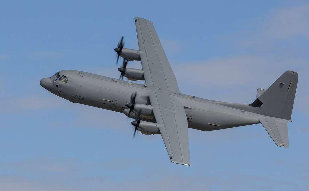 A C-130J-30 Super Hercules banks in flight.