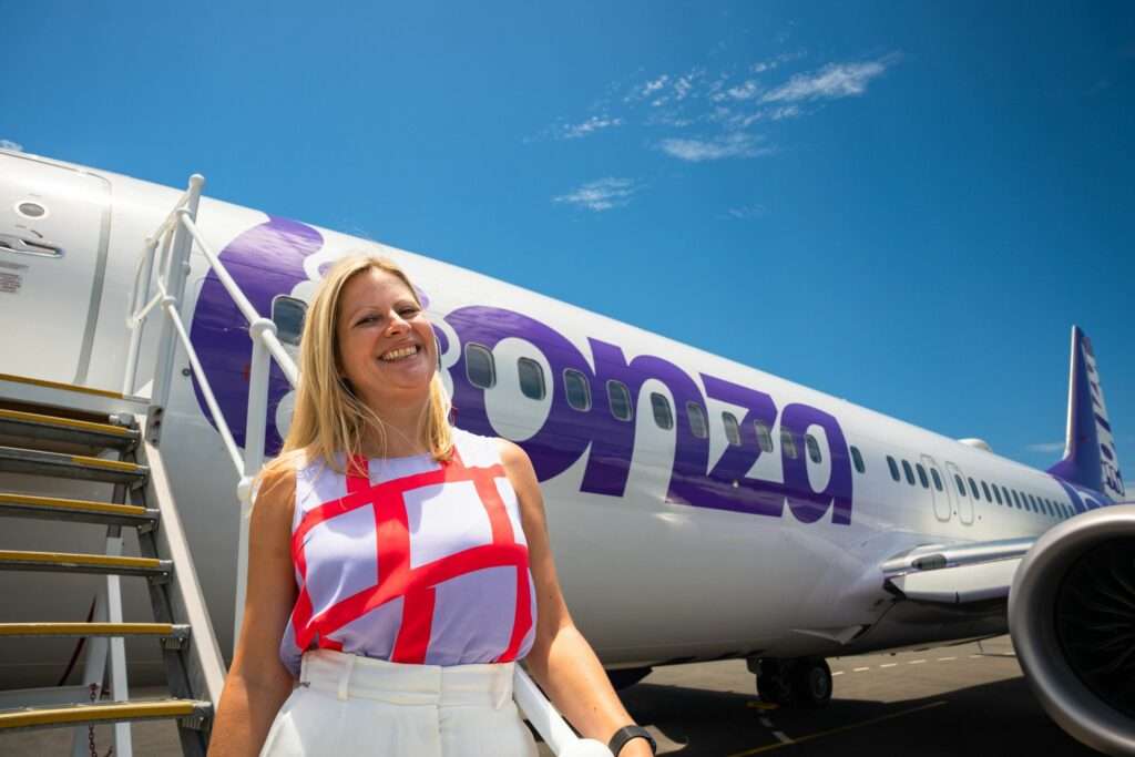 Outgoing Bonza CCO Carly Povey with Bonza aircraft.