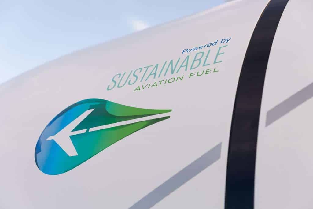 A sustainable aviation fuel logo on the side of an aircraft.