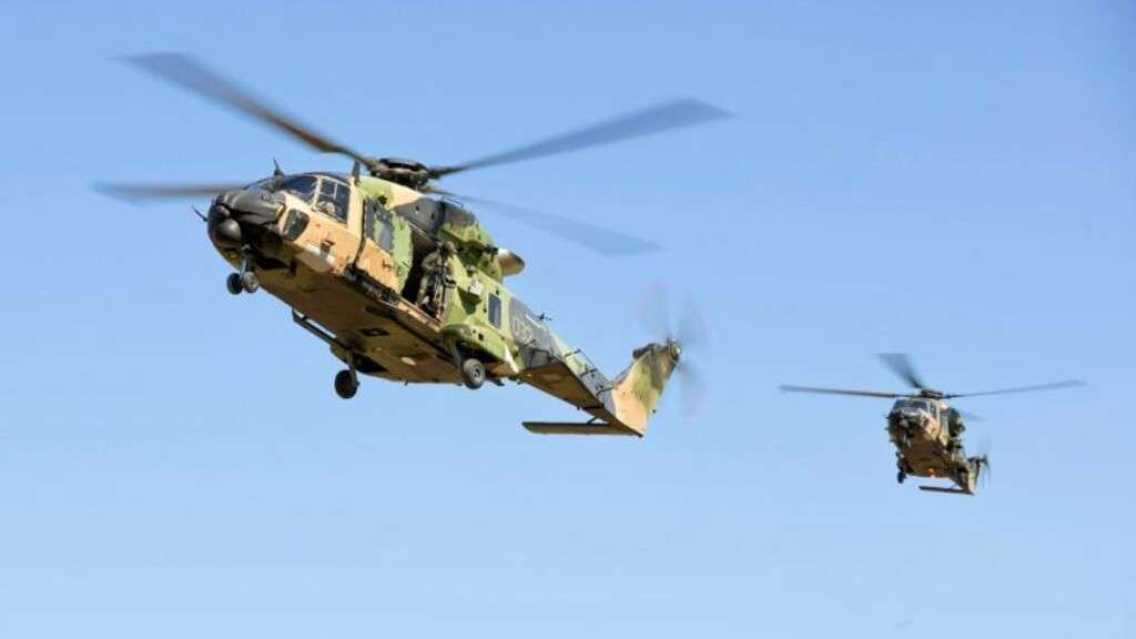 Two Australian Army MRH-90 Taipan helicopters in flight.