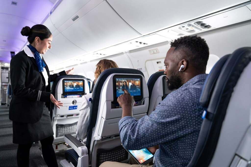 Passengers use Bluetooth system on United Airlines flight.