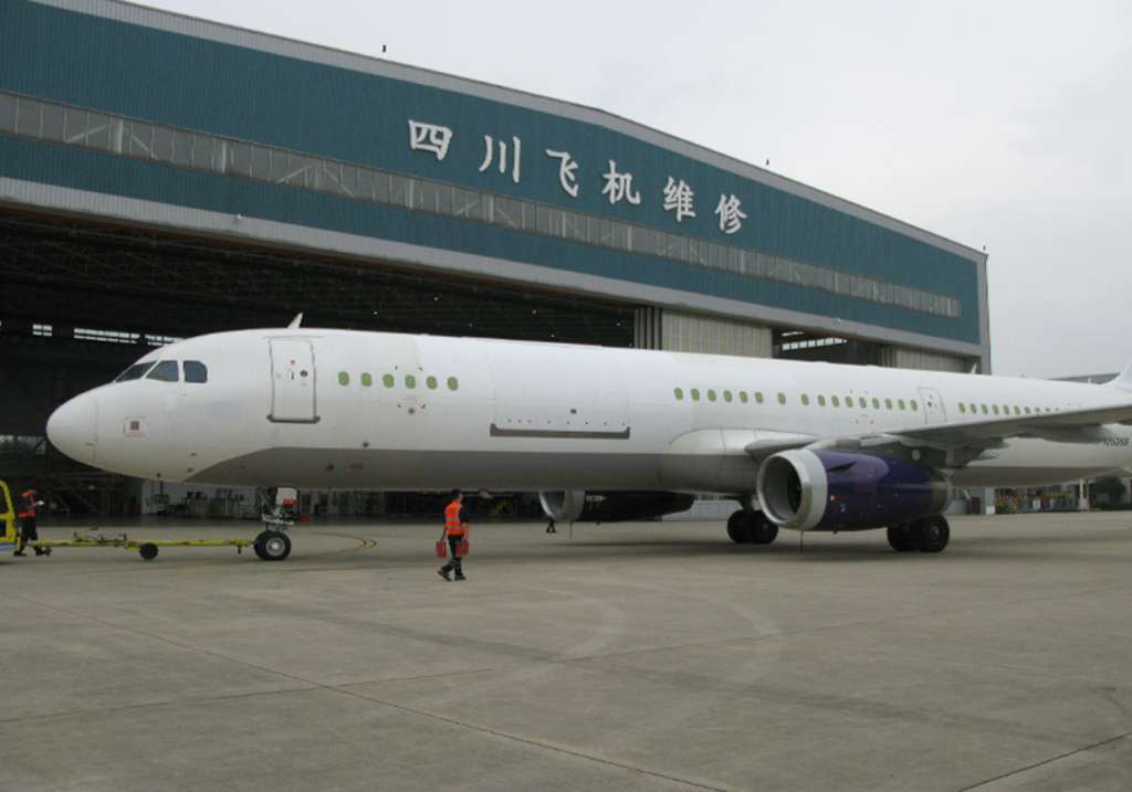 A 321 Precision Conversions A321-200PCF freighter in front of the hangar.